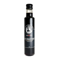 Schlanke schwarze Flasche Joes Blattgold Balsamico Cassis mit 250 ml, schwarzes Etikett mit Joeskochwelt Wortmarke und schwarzer Verschluss